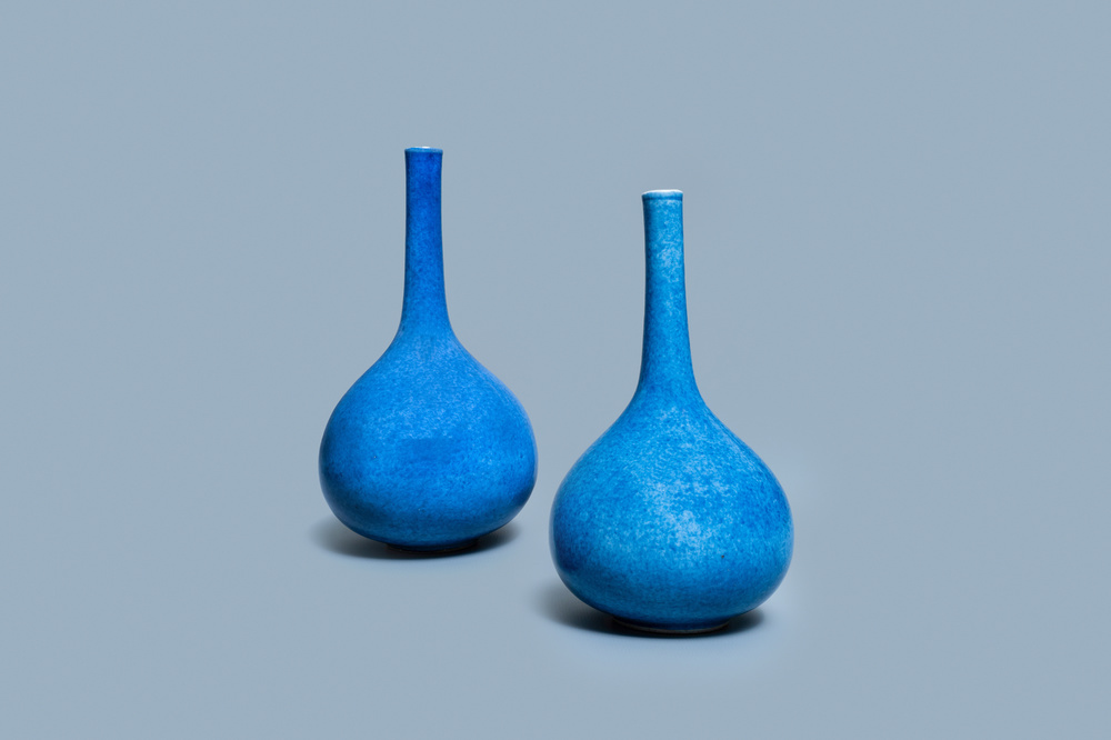 A pair of Chinese monochrome powder blue bottle vases, Kangxi